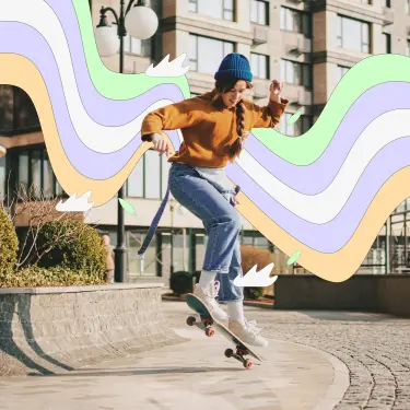 Eine junge Frau macht einen Sprung mit einem Skateboard